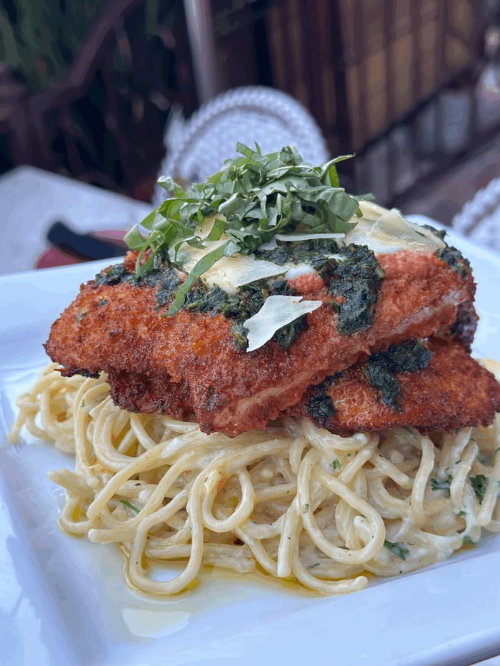 Chicken milanese with spaghetti alfredo and buffalo mozzarella