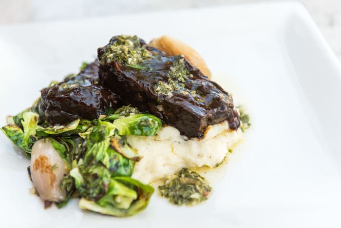 Braised beef short ribs with gremolata and mashed potatoes